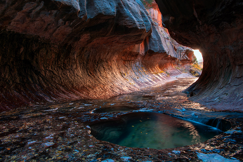 Tunnel with red or oranges walls known as The Subway in Zion.