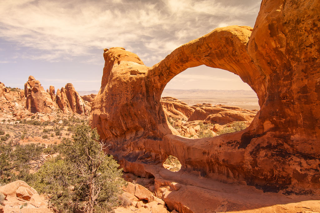 orange rock formation of Double O arch in Arches National Park.