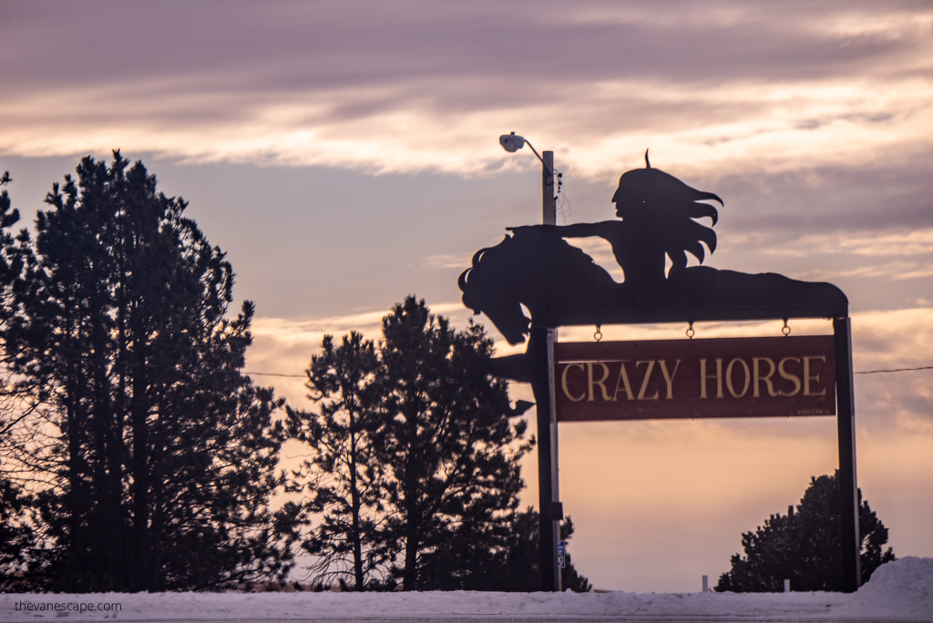 Road sign with directions to Crazy Horse Memorial in South Dakota.