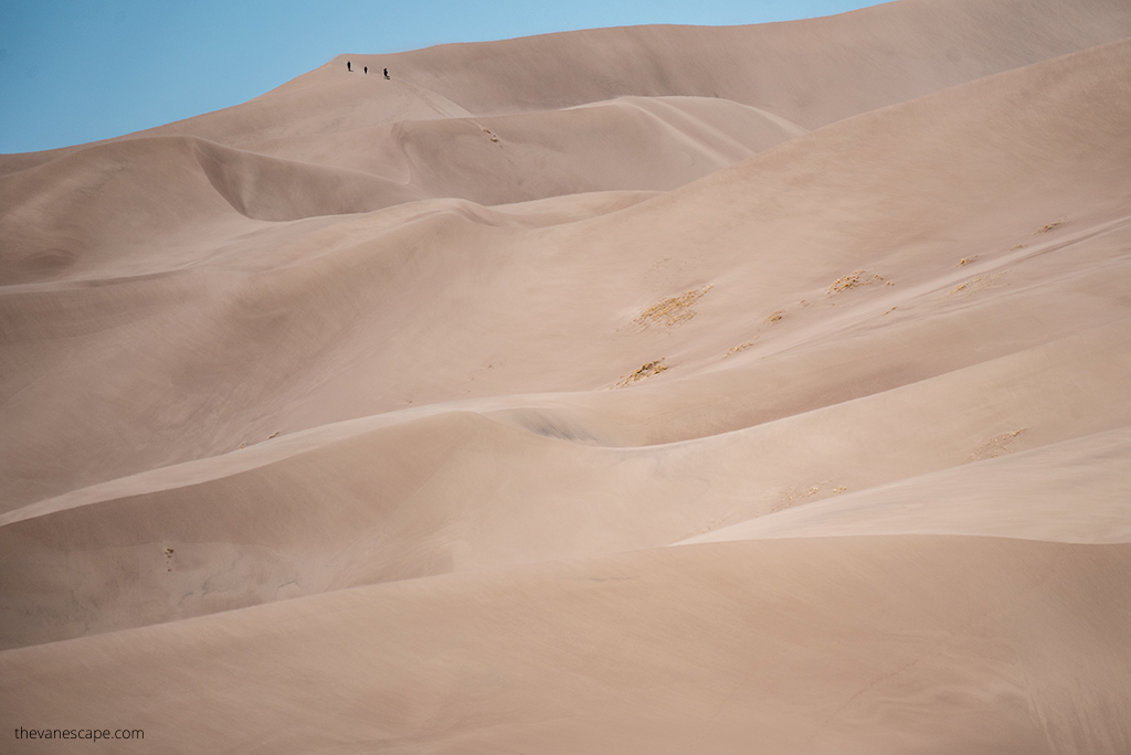 Huge sand dune and people on the top in  Great Sand Dunes National Park.