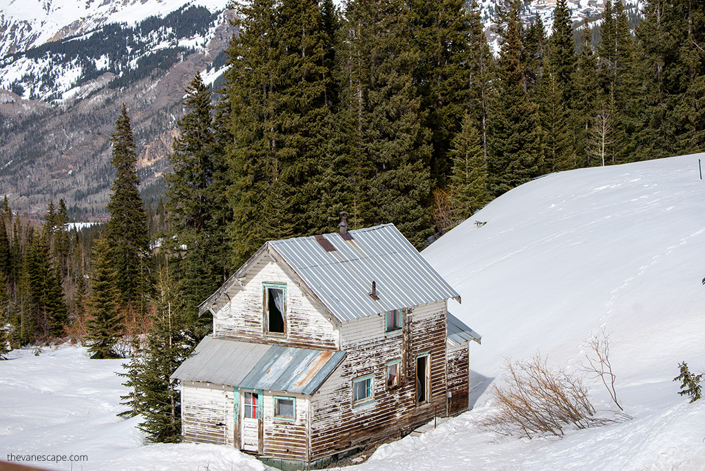 Old mining buildlings on the Million Dollar Highway with snow scenery. 