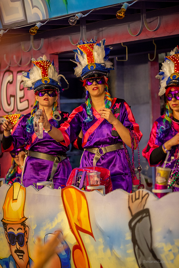 women in purple costumes.