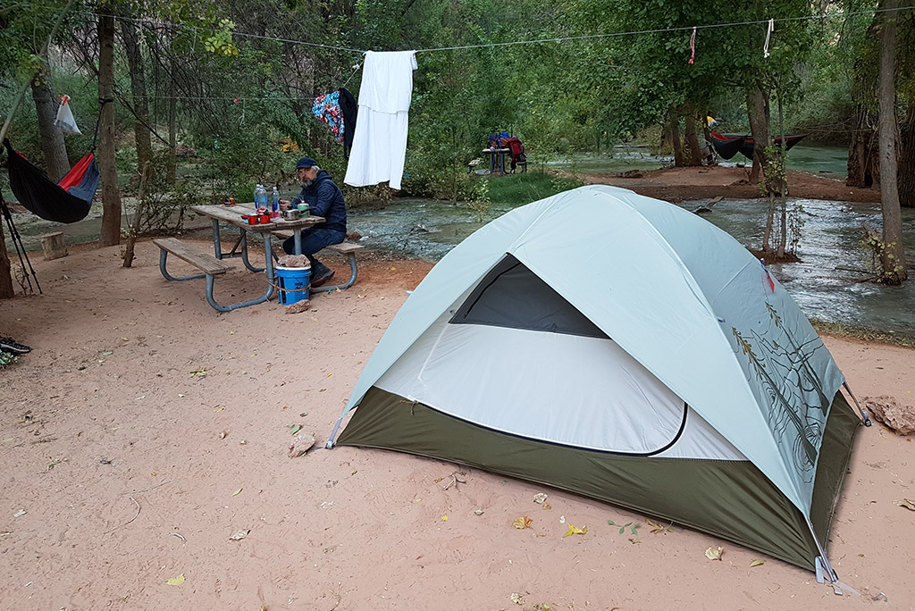 Campground with a tent and picnic table in Havasu Falls.