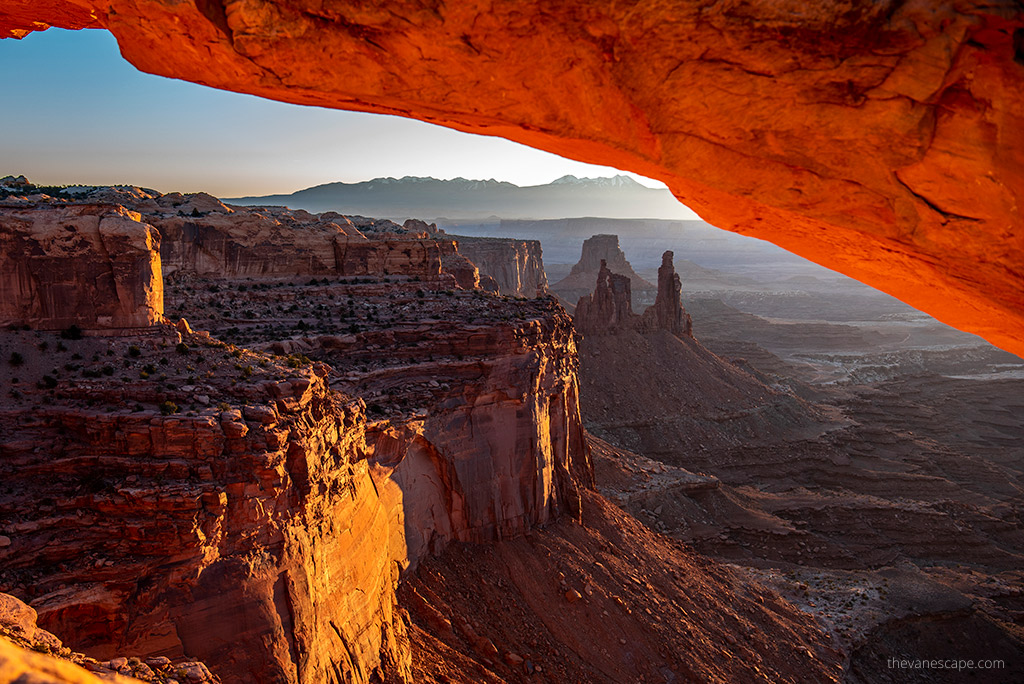 Utah Mighty 5 Road Trip Itinerary: orange rock formations during sunrise in Canyonlands National Park.