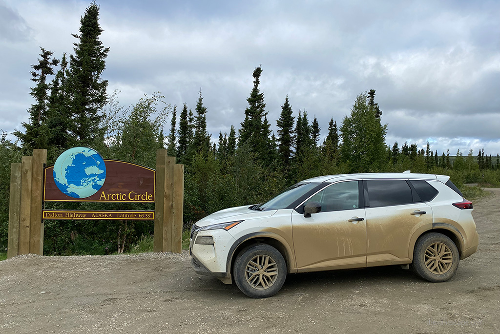White car with the sign Arctic Circle.