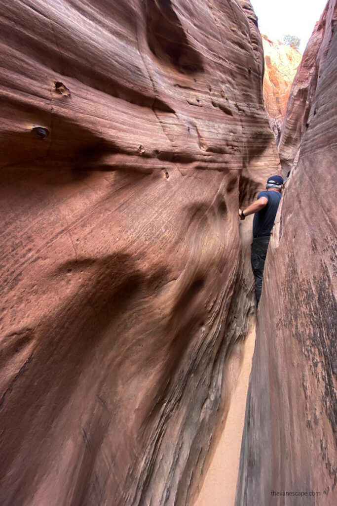 Chris squeezing Zebra Slot Canyon.