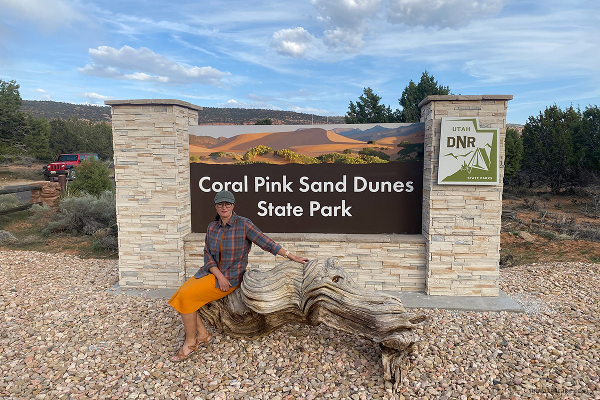 Agnes Stabinska, the author, at the entrance to Coral Pink Sand Dunes State Park.
