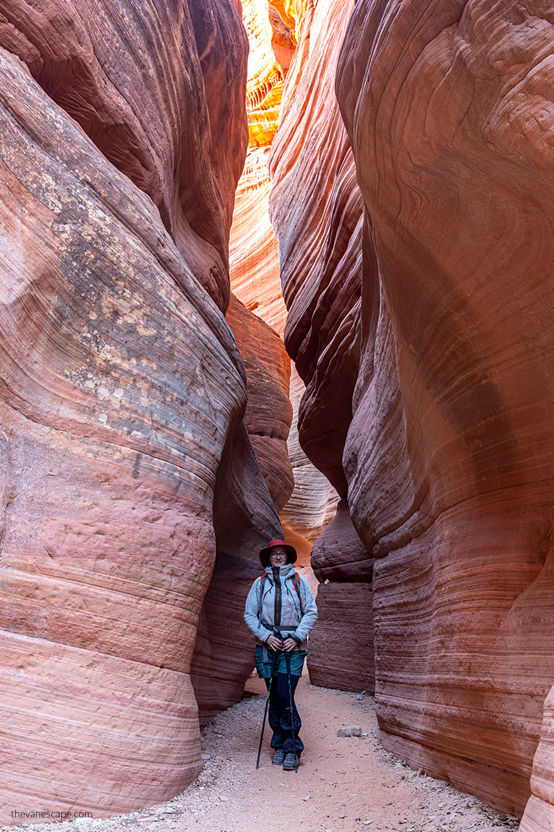 Agnes Stabinska, the author, in Peekaboo Canyon in Kanab between narrow red walls.