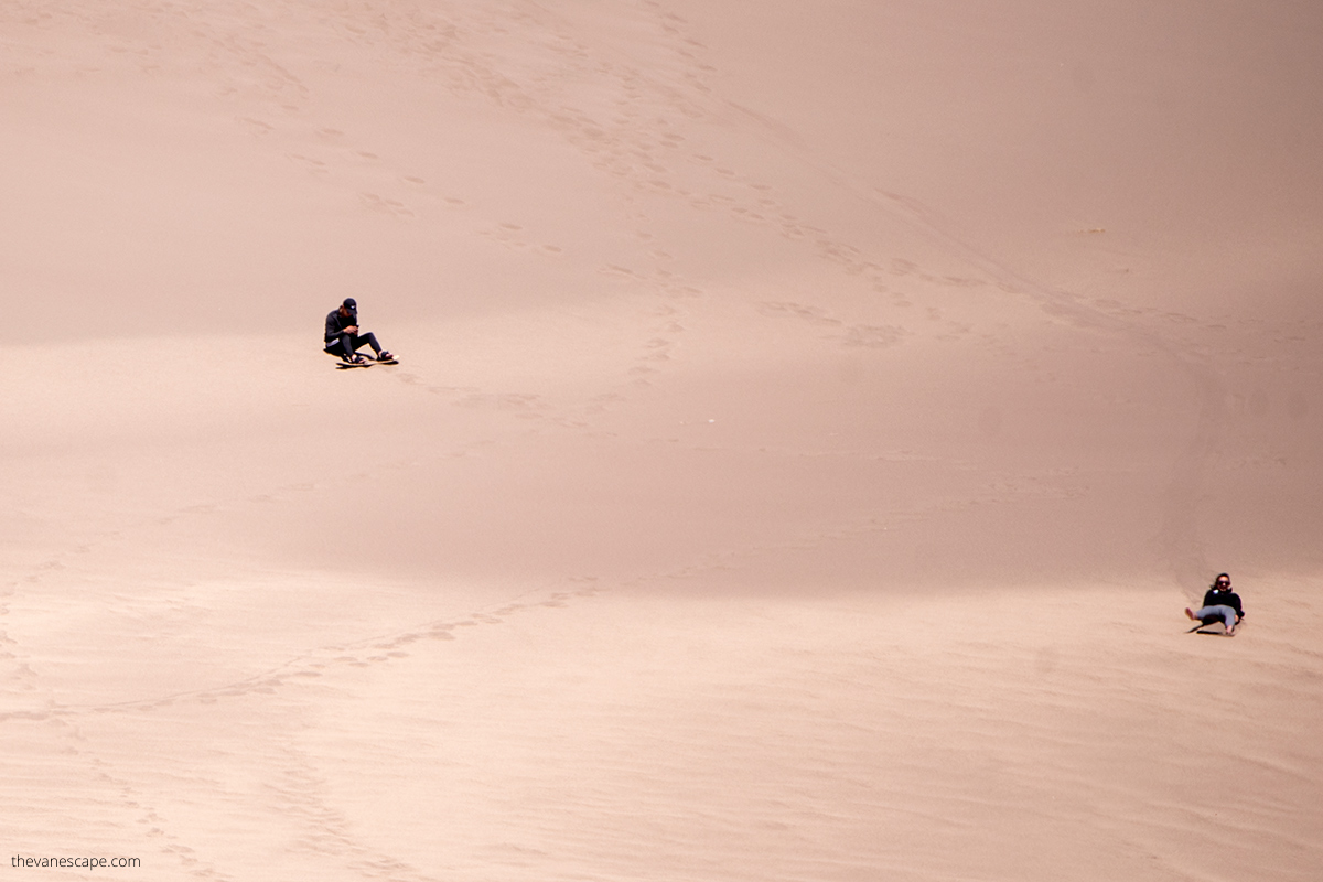 sandboarding on dunes.