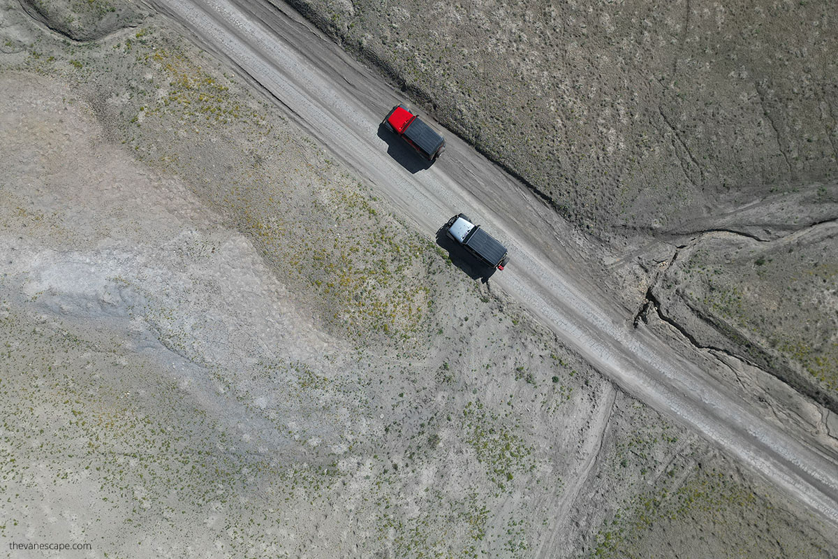 Jeeps on the road view from above taken by dron.