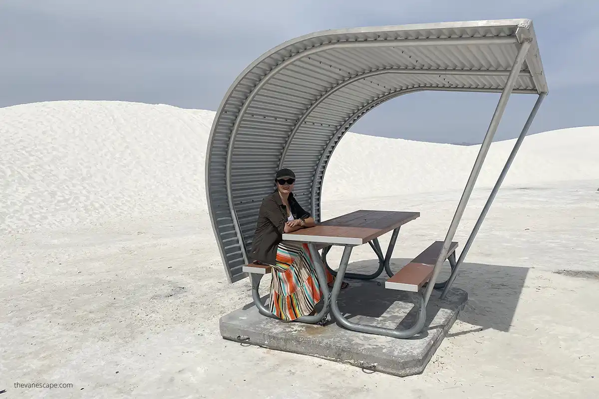 Agnes Stabinska, the author, is sitting in a shelter in the picnic area in White Sands National Park. 