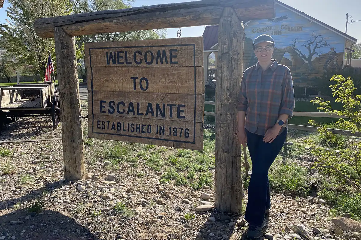 Agnes Stabinska, the author, at the front of hotel in Escalante.