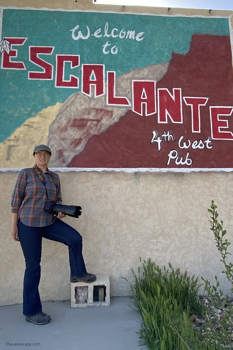 Agnes Stabinska, the author, with welcome to Escalante sign.