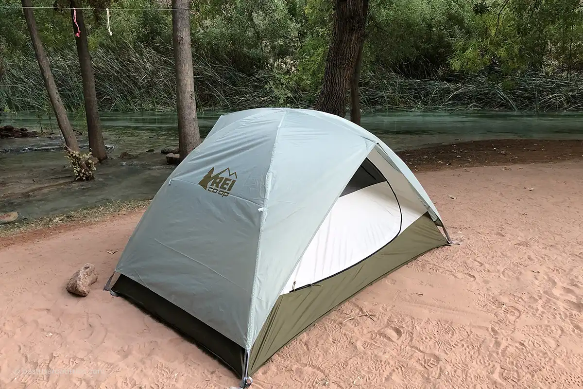Backpacking tent beside Havasu Creek at Havasu Falls Campground.