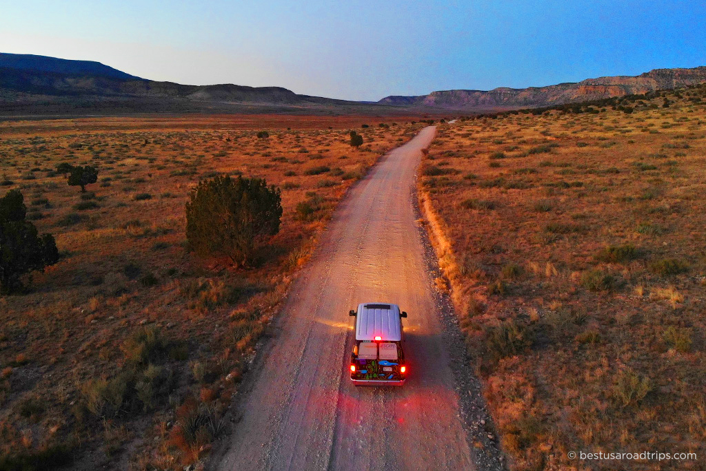 Van on the road in Arizona during sunset.